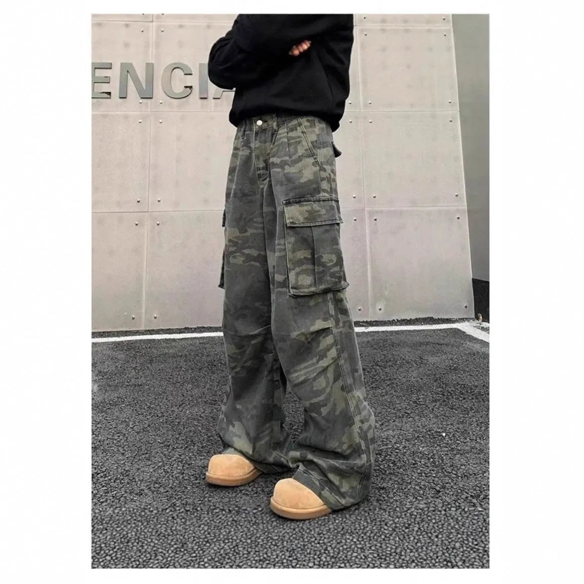 Korean style washed camouflage cargo trousers with multiple pockets on a mid-waist fit.