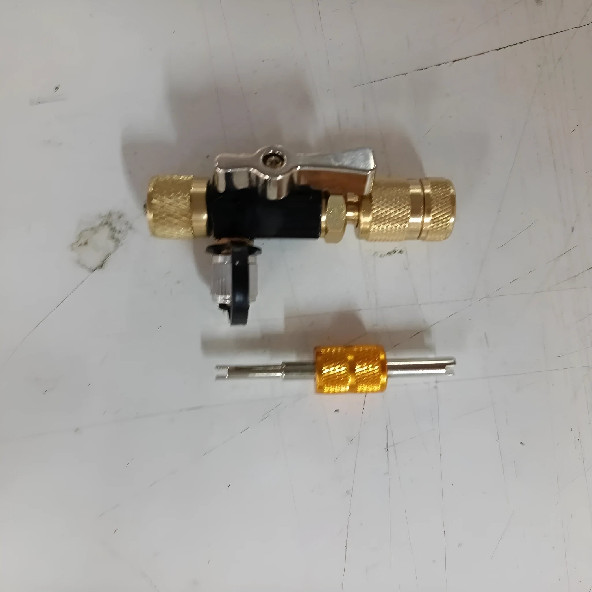 Vacuum valve core disassembly tool set with black and pink metal removers