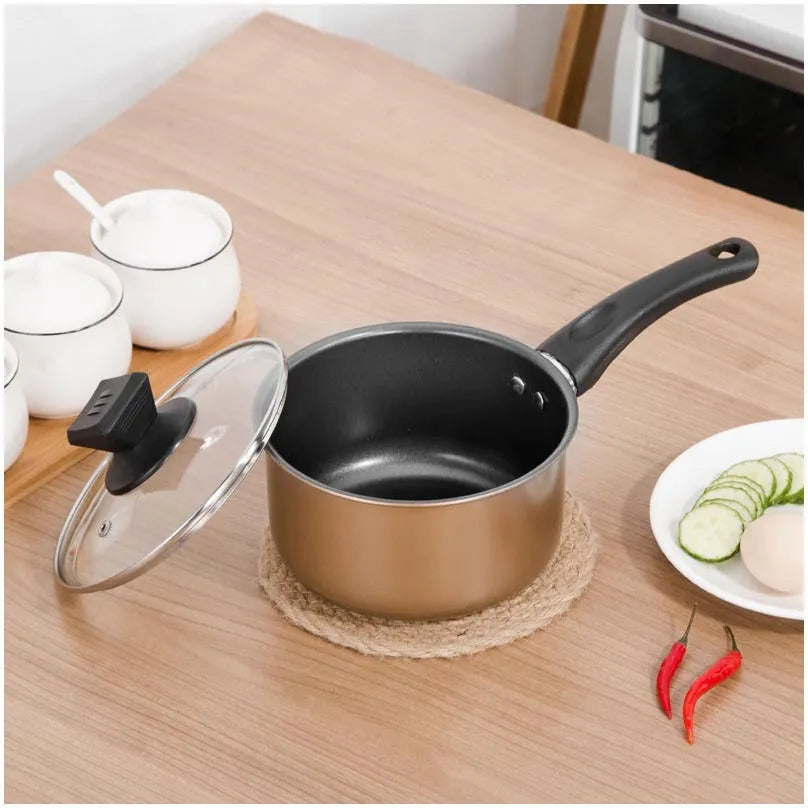 Three-piece cast iron cookware set with soup pot, milk pot and wok featuring non-stick coating