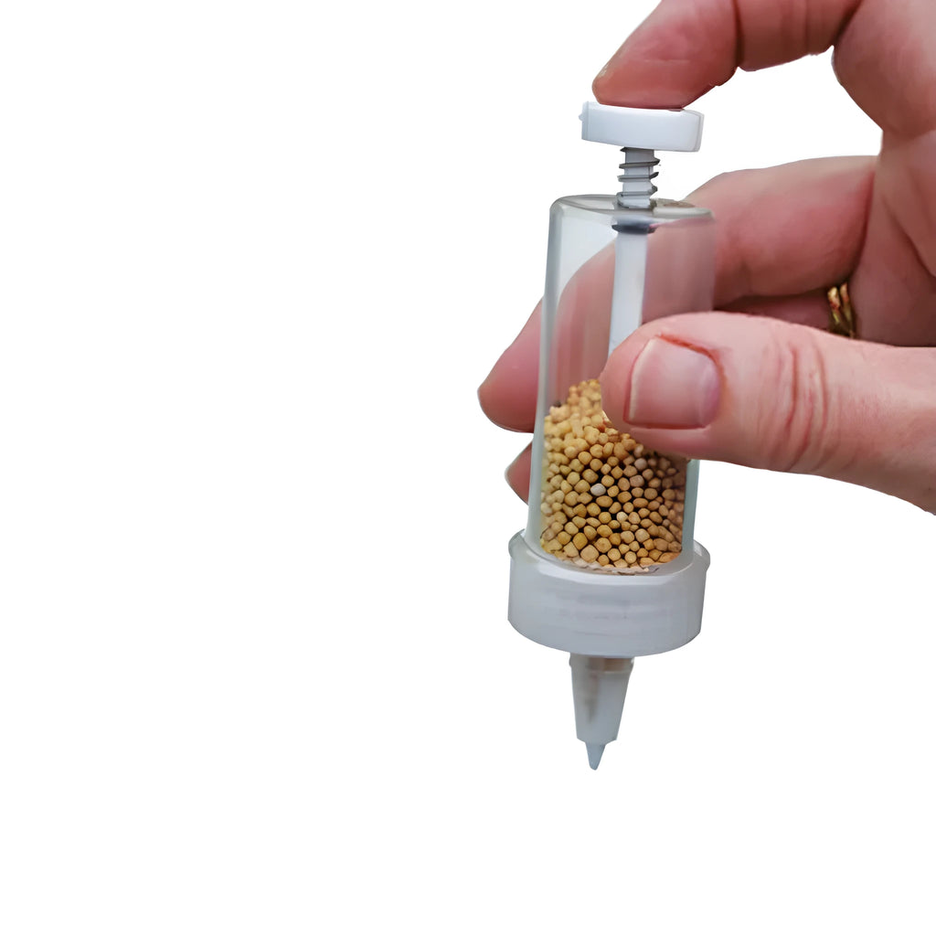 Compact 12 cm long plastic mini planter tool for sowing seeds in pots and trays.