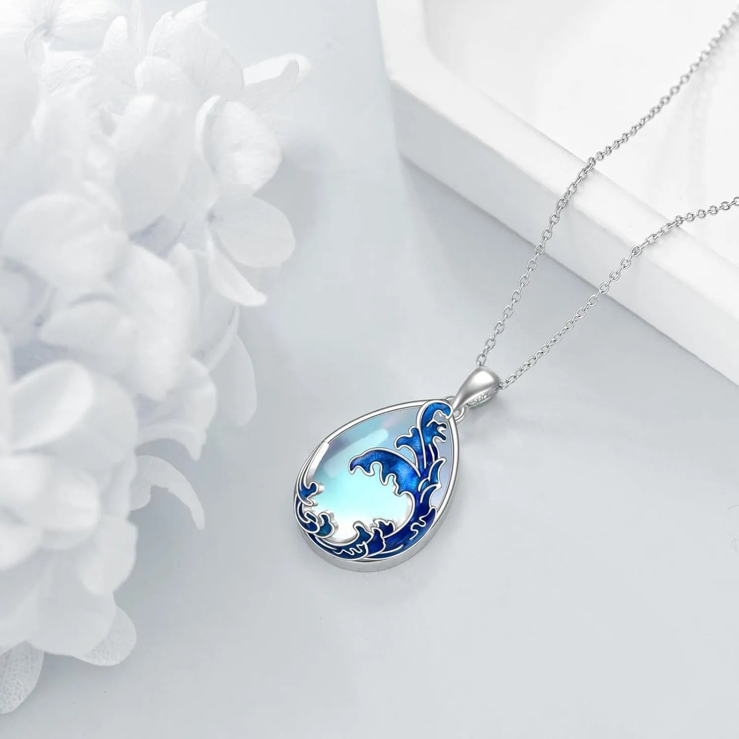 Moonstone blue heart-shaped alloy pendant necklace on a silver-plated chain for women.
