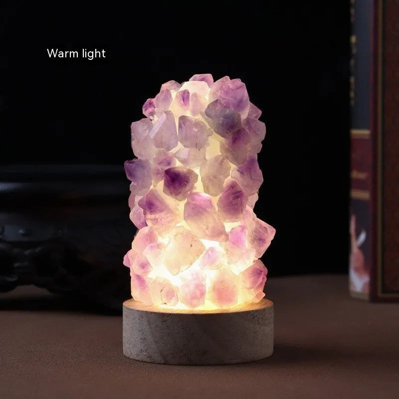 Natural amethyst crystal night light with USB plug showing both warm and cold light settings