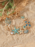 Alloy rhinestone bracelet with boat anchor, marine shell, and starfish charms in blue, red, or turquoise.