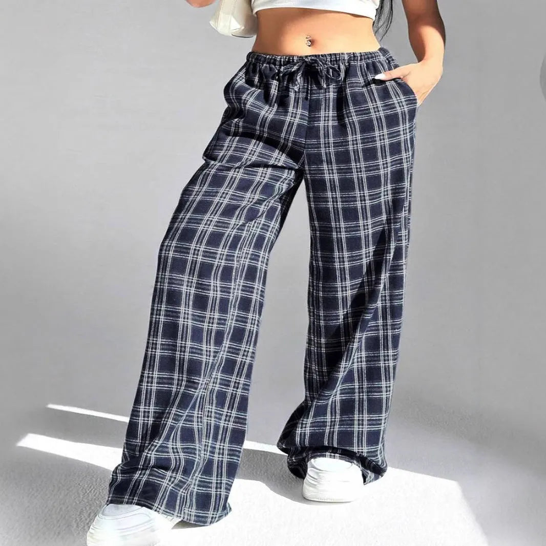 Women's loose plaid trousers with drawstring waist and side pockets in red or blue colour options