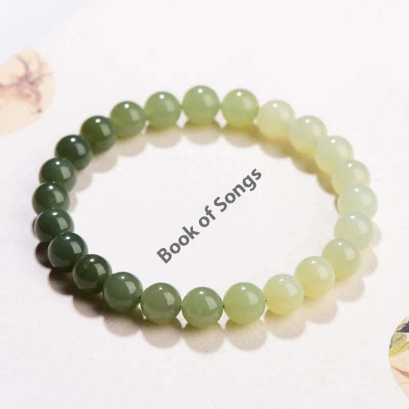 Natural clear water Hetian jade ball bracelet with gradient beads in round or barrel style.