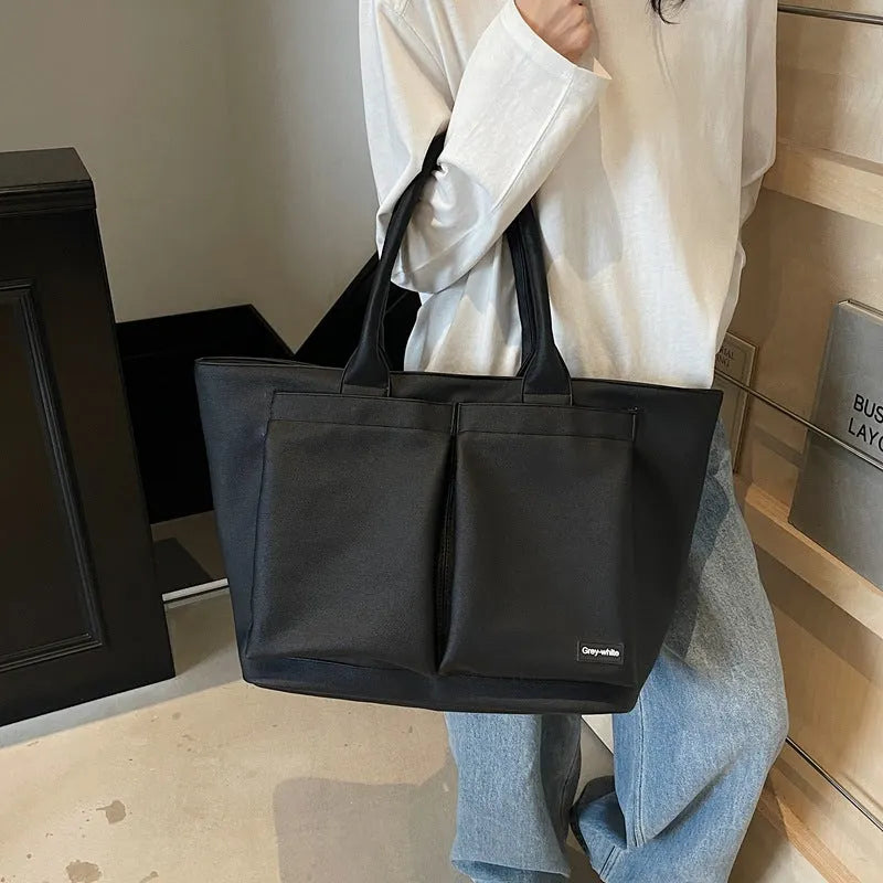 Lightweight PU shoulder bag in solid colour with adjustable 20-35L capacity for sport and travel
