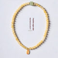 Hand-woven yellow jade topaz bracelet with 6mm mantra beads and fu character retro design