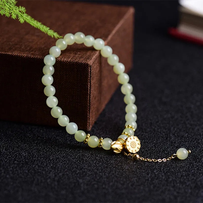 Shihuan natural Hetian jade bracelet with 6mm beads and a central fu character.