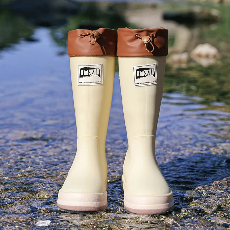 A pair of high tube PVC rain boots for men and women in a choice of colours.