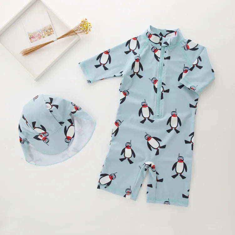 Boy's penguin print long sleeve swimsuit one-piece with matching swim cap for sun protection