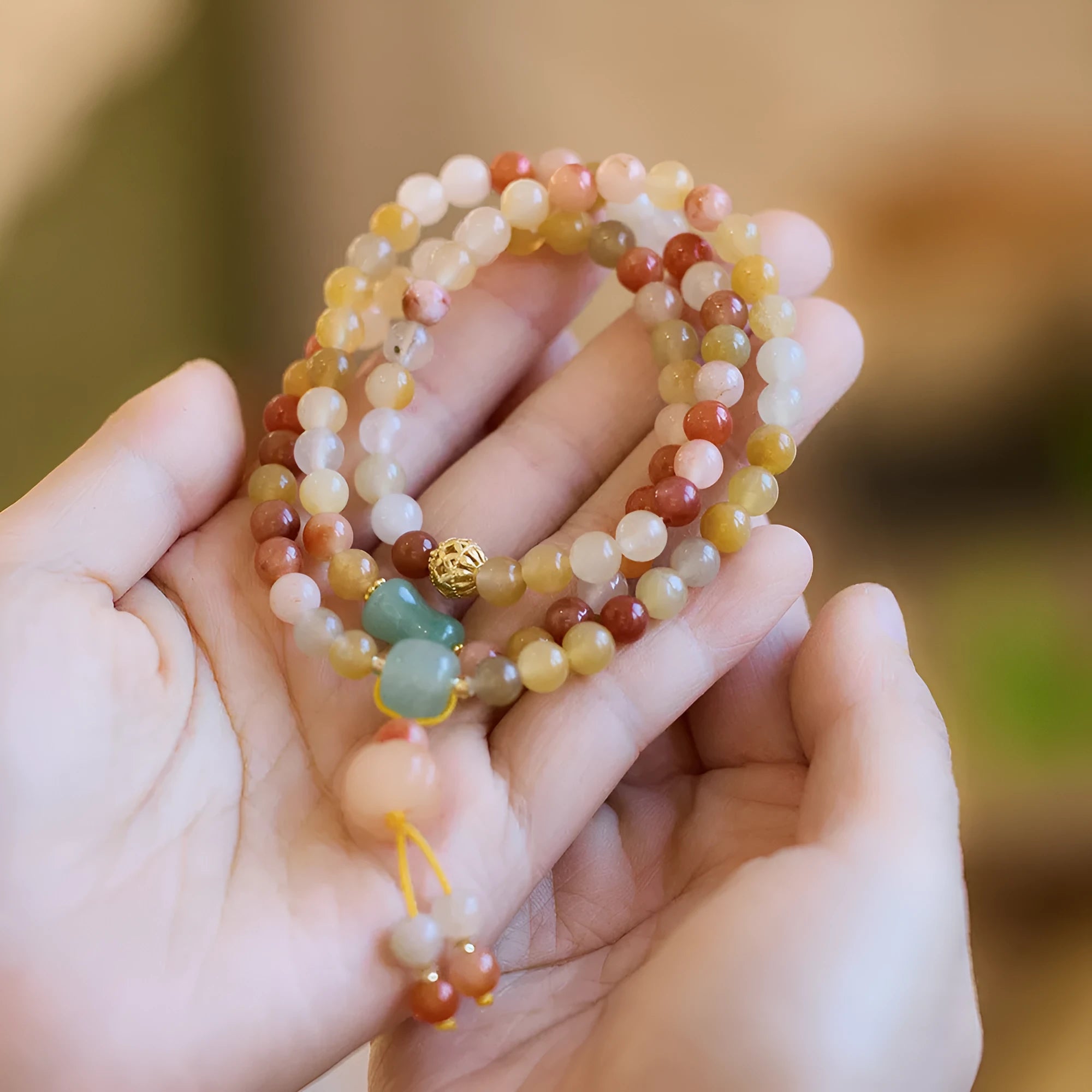 Women's handcrafted three-circle pumpkin tassel bracelet in Jinsi Jade