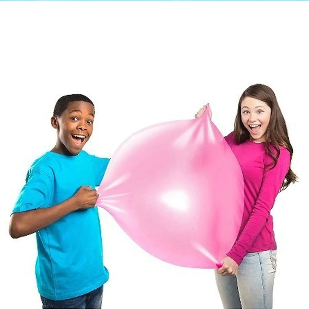 Large pink, yellow, green, and blue inflatable TPR bounce balls in different sizes.