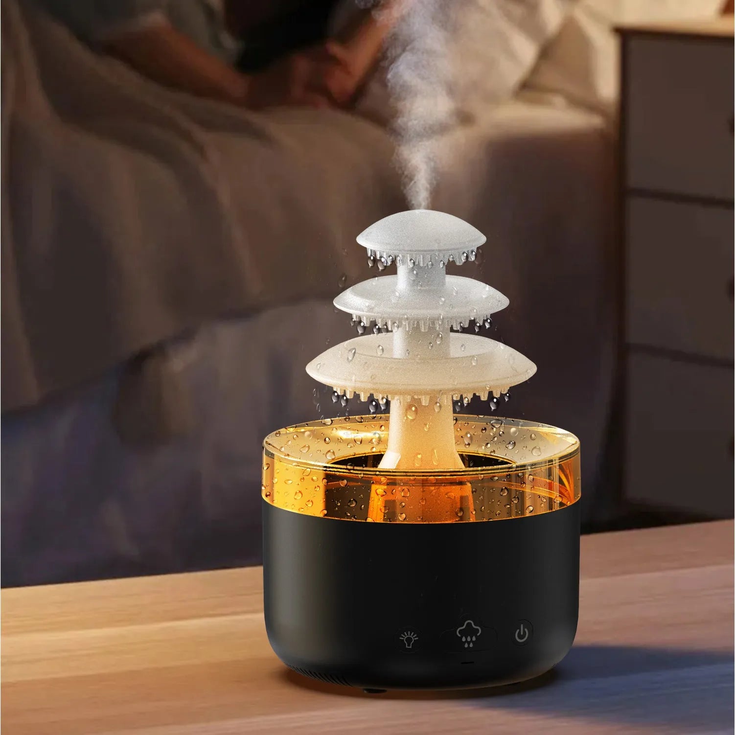 White cloud-shaped USB humidifier and essential oil diffuser with colourful mood lights on a wooden table.