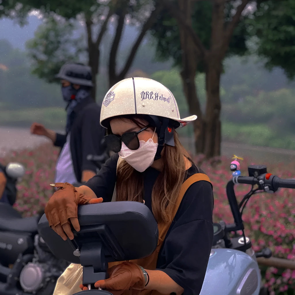 Retro black and gradient blue half helmet for electric bicycles with a blue lens.