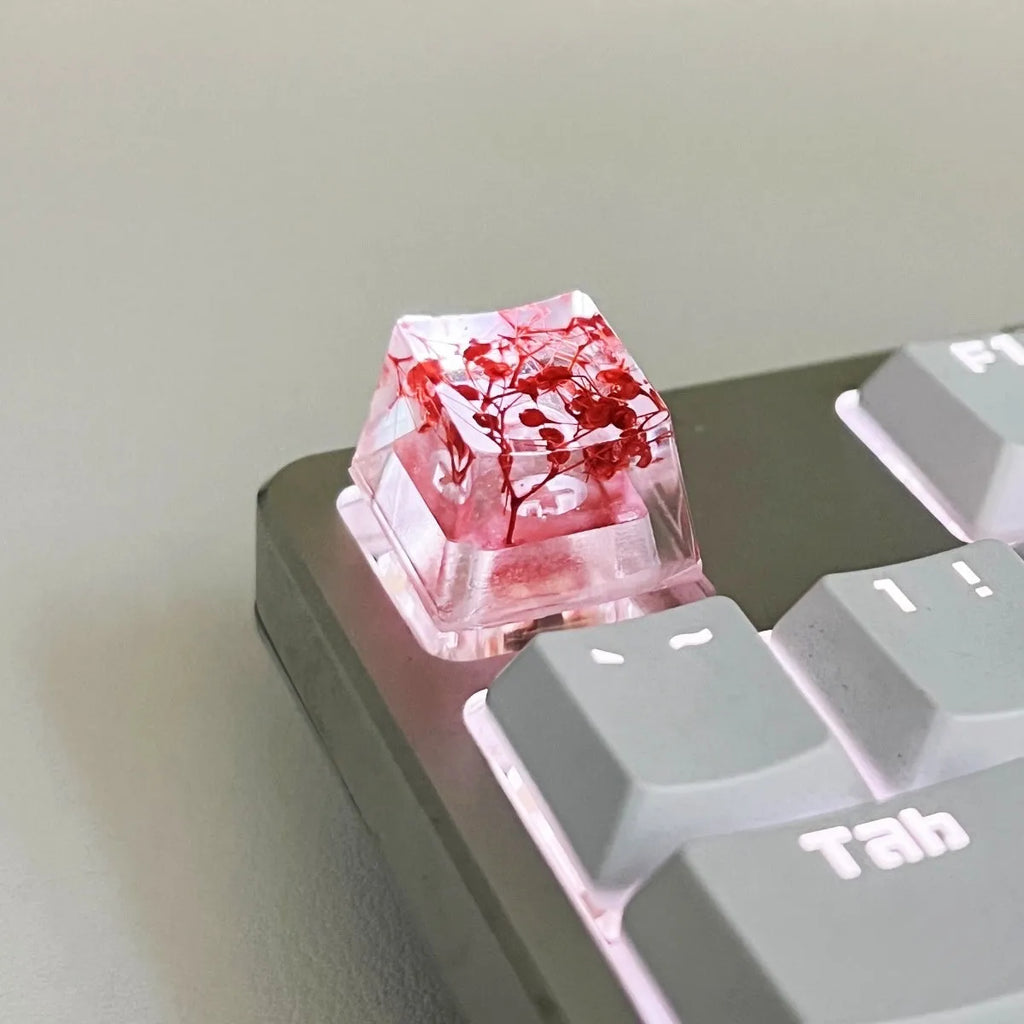 Transparent resin keycap with glitter particles creating starry night effect for mechanical keyboards