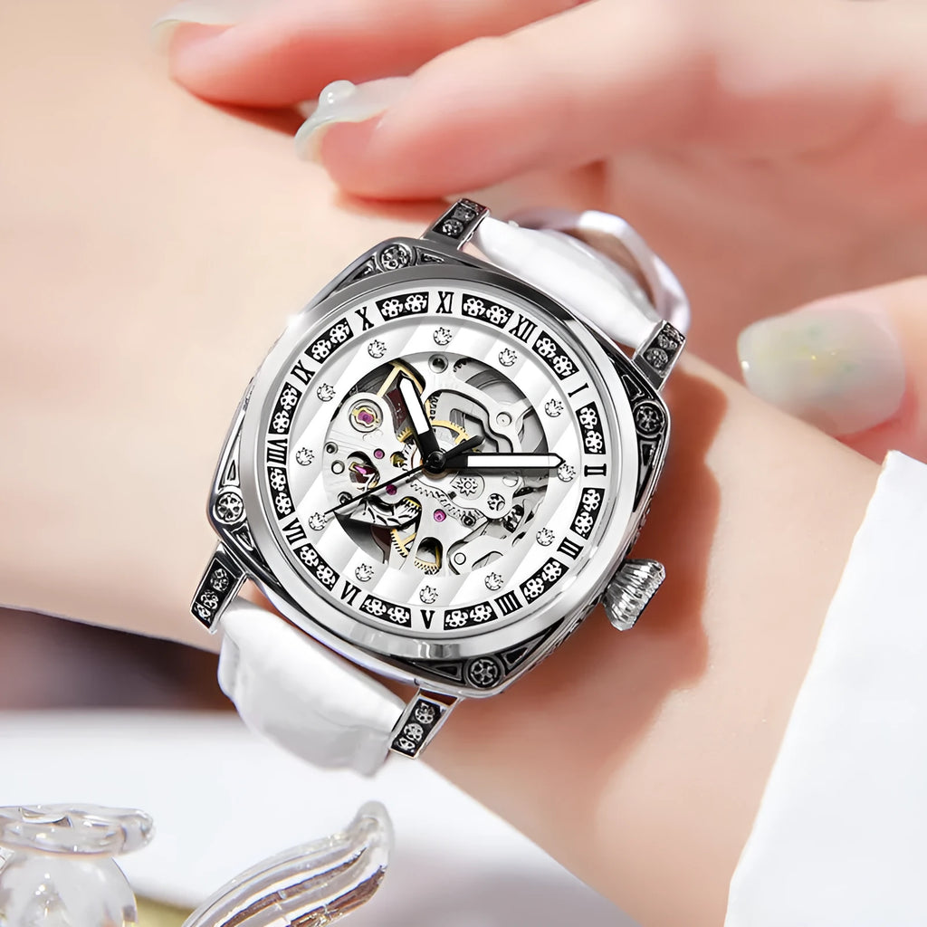 Men's mechanical watch with luminous hands and a black leather strap showing analogue dial.