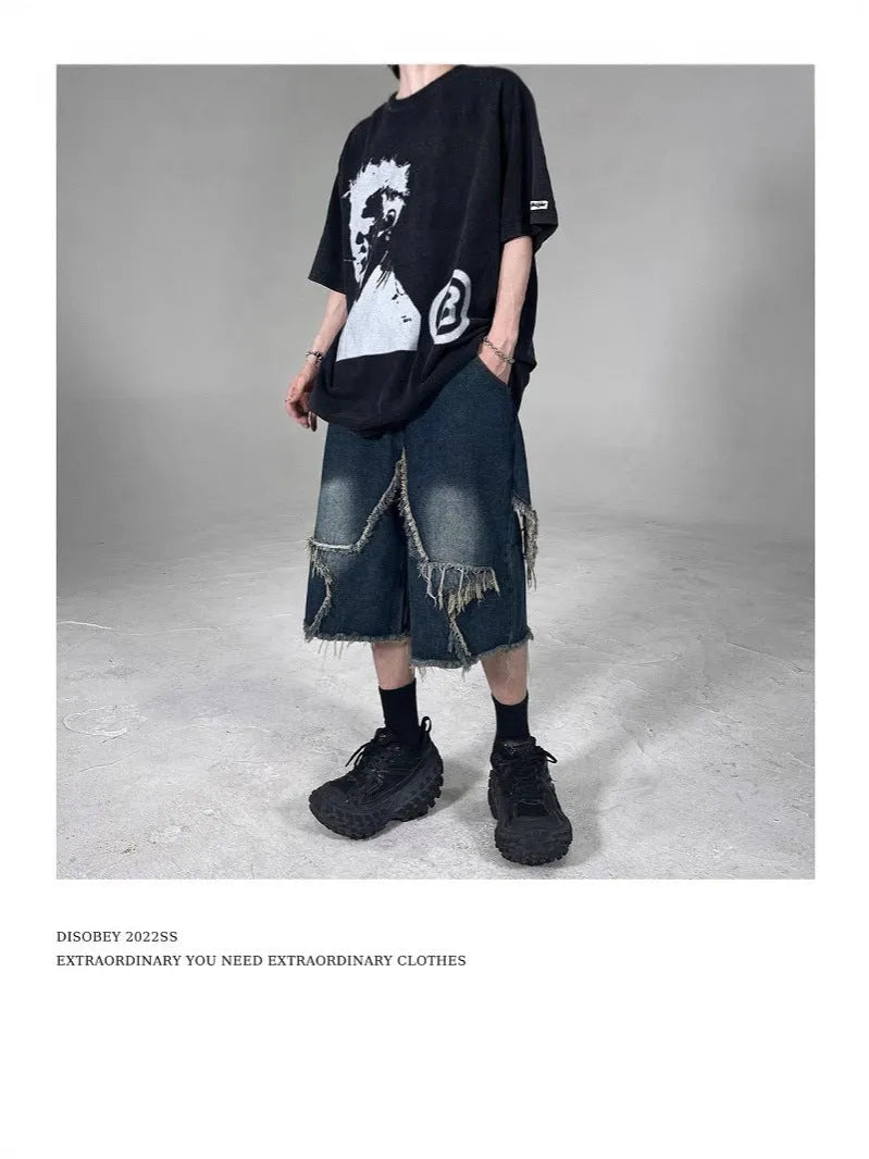 Blue retro-style men's denim shorts with a frayed five-pointed star design and a loose fit.