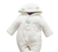 Baby wearing white cotton padded romper with lamb design and feet covers