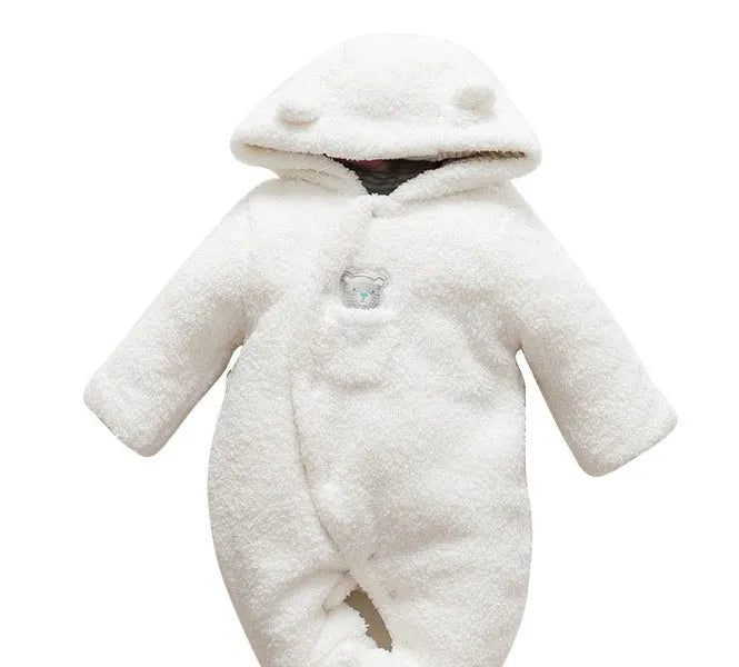 Baby wearing white cotton padded romper with lamb design and feet covers