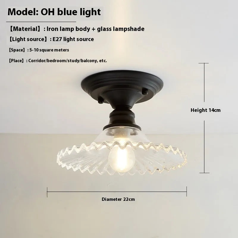 American retro single-head ceiling lamp with clear glass shade showing exposed filament style