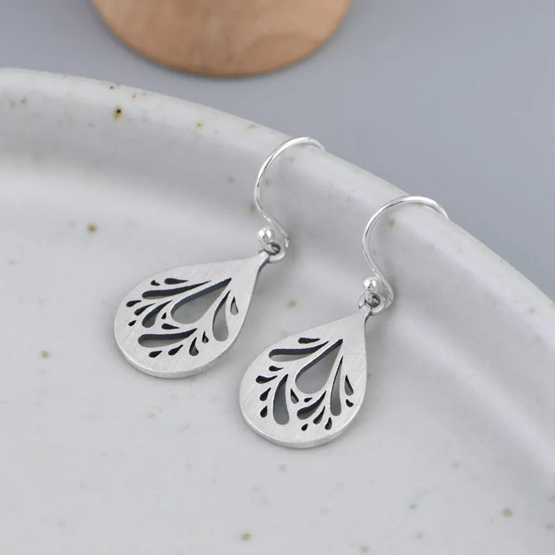 Pair of retro-style hollow water drop earrings made from 925 sterling silver
