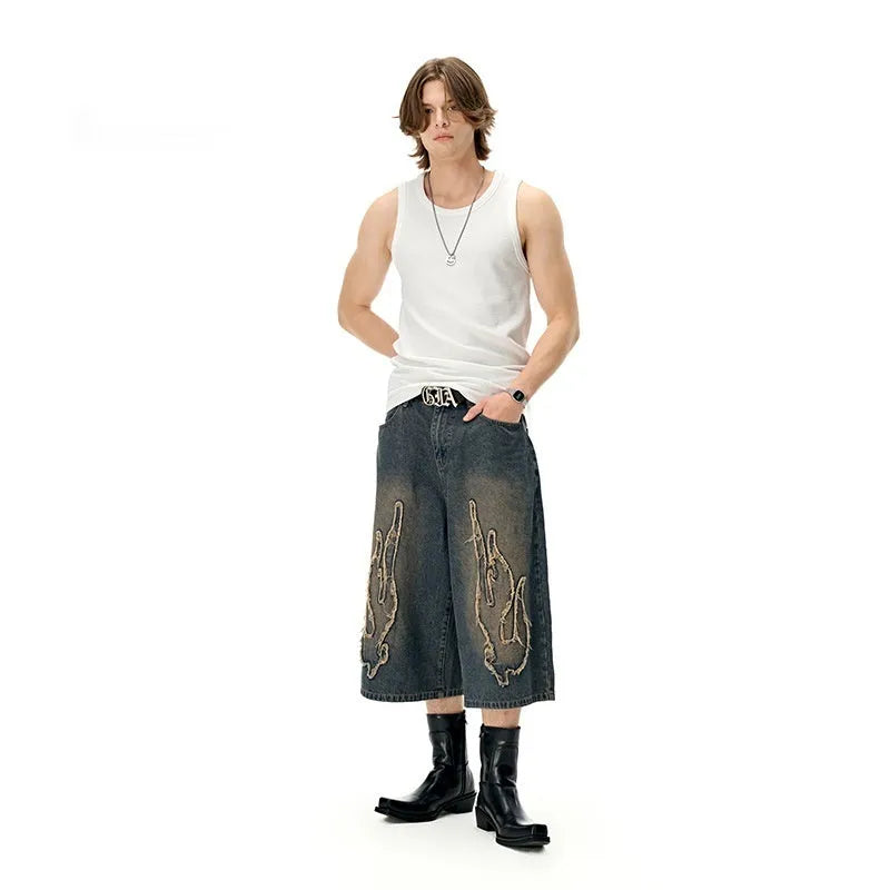 Men's black denim shorts with cropped flame embroidery detail on straight-leg summer casual shorts