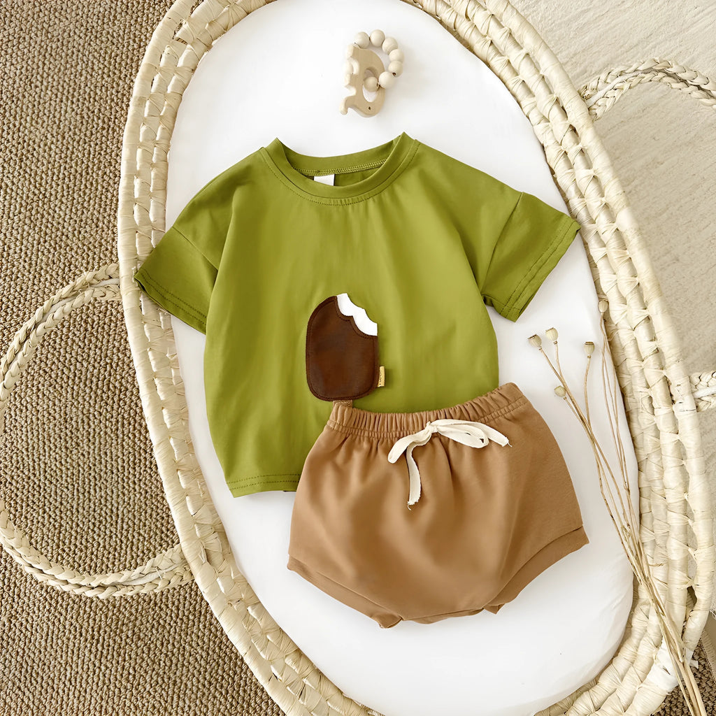 Girls' olive green cotton shorts suit set with ice cream patch detail on short sleeve shirt.