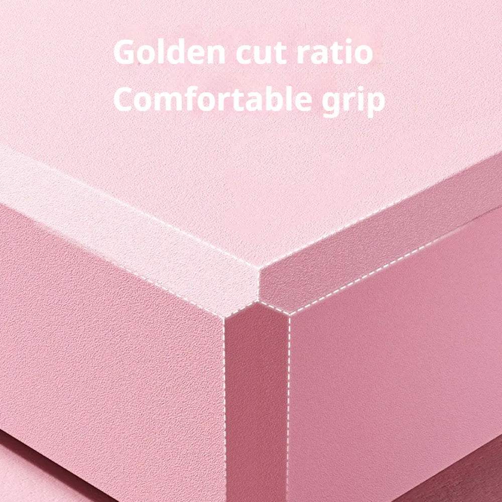 Solid colour high-density EVA yoga block on a gym floor.