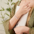 Women's Hetian jade bracelet with woven strap in diamond shape featuring lotus seedpod design