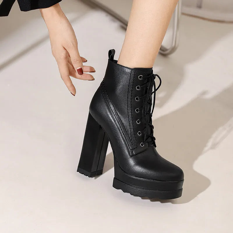 Women's black waterproof platform boots with chunky heel, cowhide upper, and side zip closure