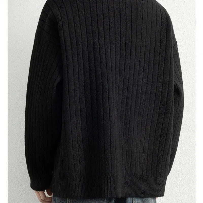 A grey men's loose-fit half-zip sweater with a textured knit and long sleeves.