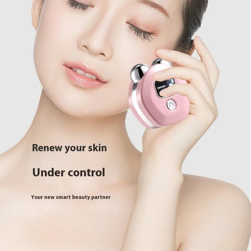 Portable white hot compress micro current double-roller facial massage instrument with USB cable.