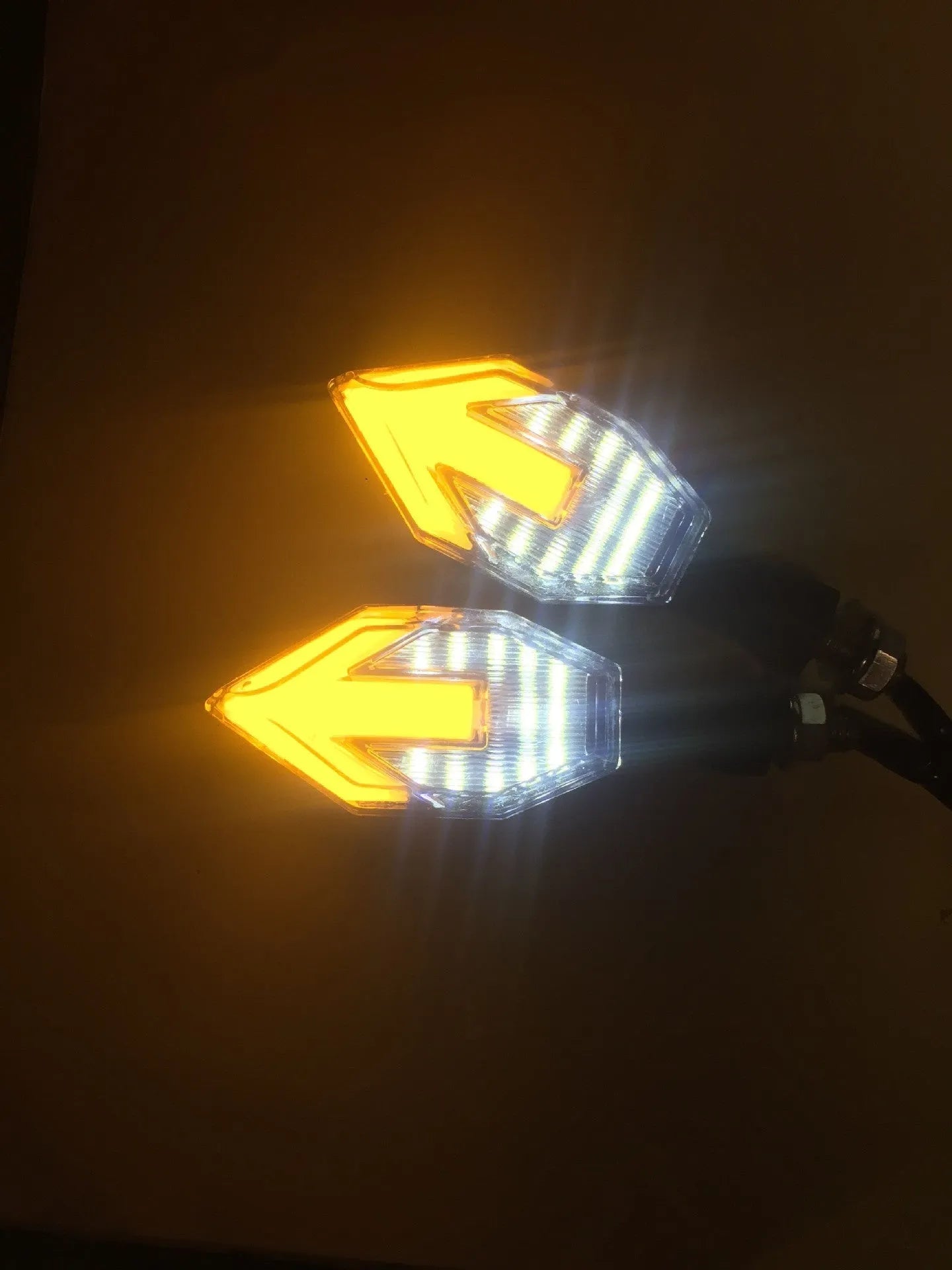Arrow-shaped 12V LED motorcycle turn signal light in yellow with choice of blue, red, or white accent.