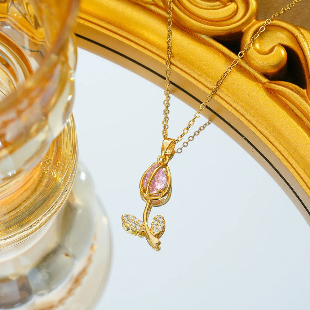 Zircon tulip flower pendant necklace on an adjustable titanium steel chain, shown in a gold colour.