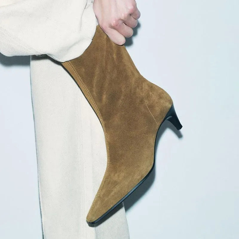 Brown square toe ankle boot with side zipper and a low kitten heel on a waterproof platform sole.