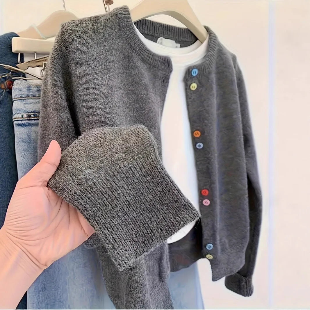 Dark grey women's button-front cardigan with long sleeves on a hanger.