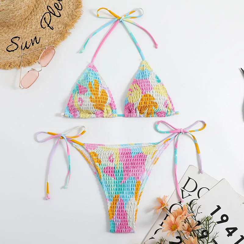 Women's multicolour floral triangle bag bikini swimsuit with split printed design and smocking craft detail.