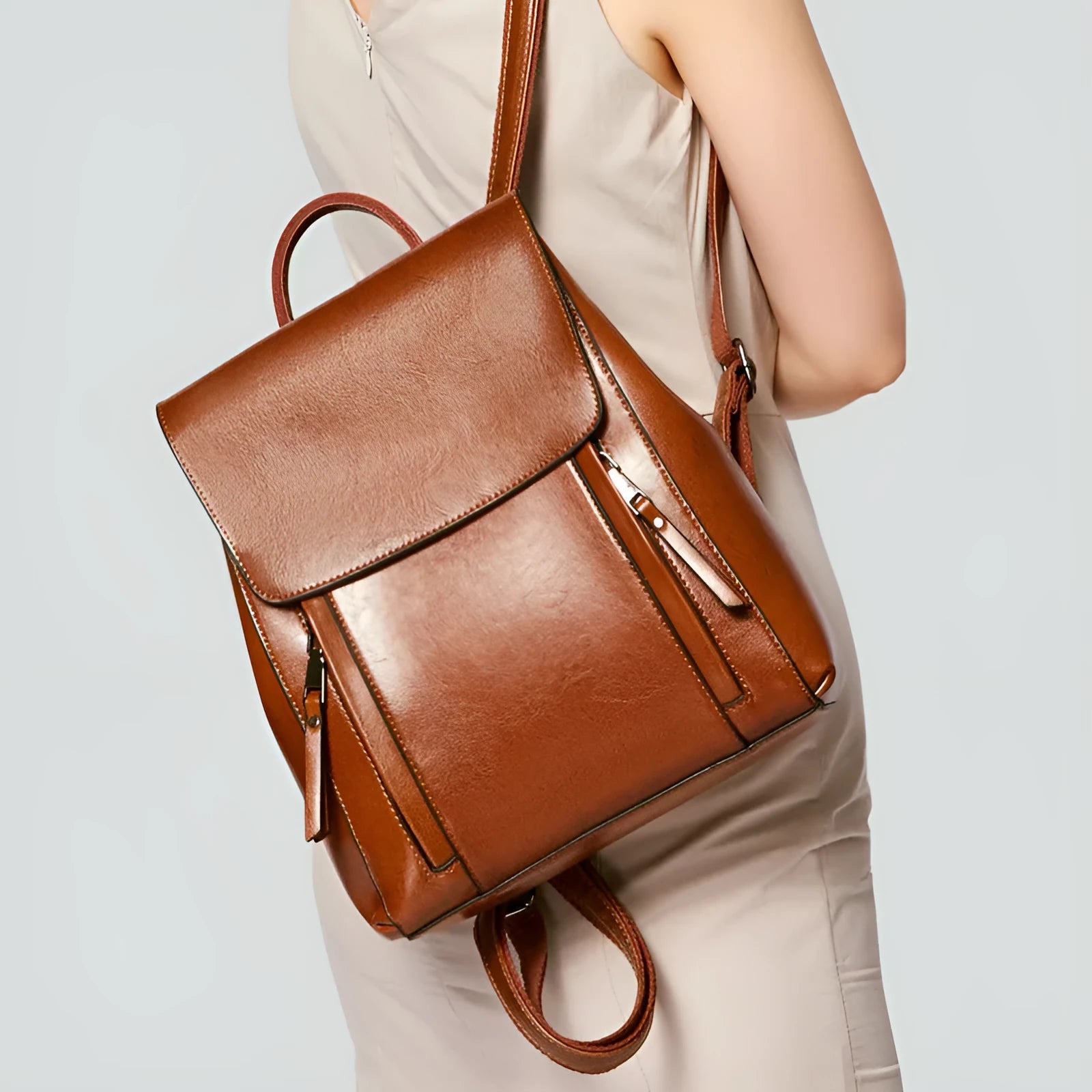 Large black genuine leather women's backpack with multiple inner pockets and double shoulder straps
