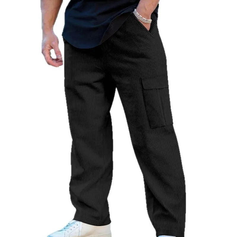 Men's loose-fitting corduroy cargo trousers in navy blue with a drawstring waist and straight wide legs.