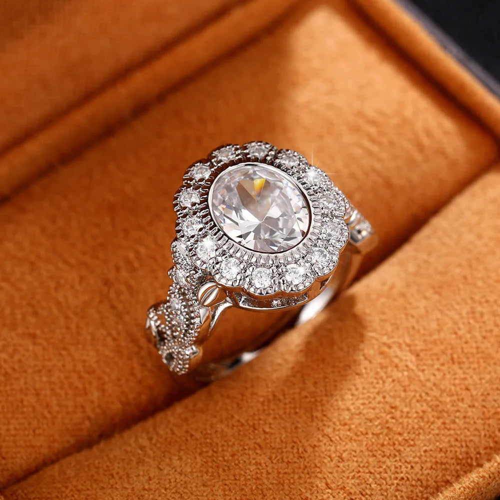 Geometric women's ring with round zircon elements in white gold colour on copper