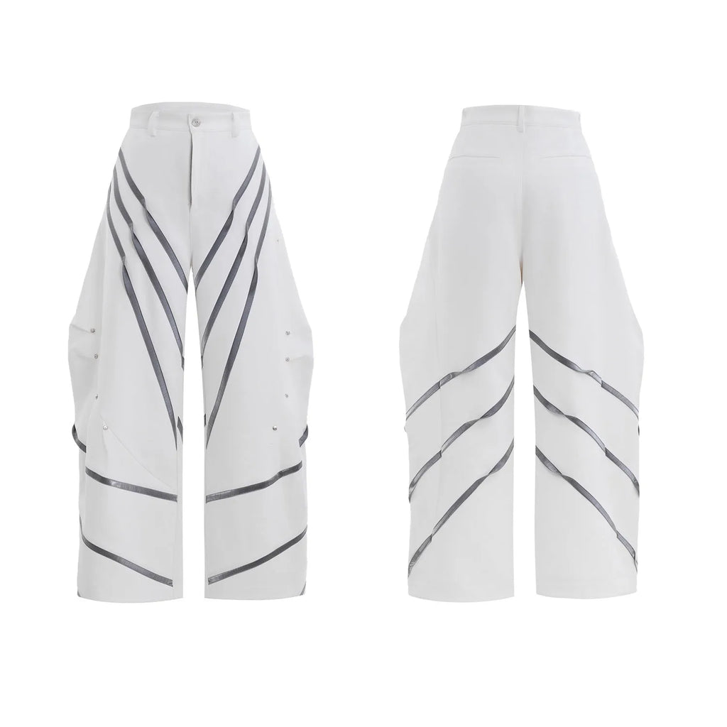 Men's black polyester trousers with metal striped rivet pleats and three-dimensional tailoring.