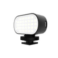 Black ST-30 handheld mobile phone fill light unit with diffuser and colour palettes.