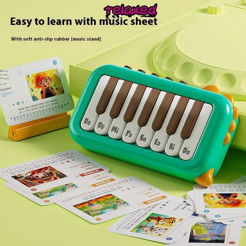 Pocket electronic keyboard toy for children in green or pink, plays little piano patterns for developmental training.