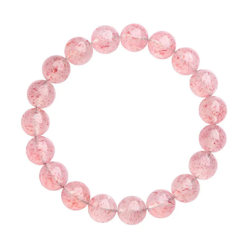 Natural white water strawberry quartz geometric ball bracelet with 10-10.8mm beads on a wrist.