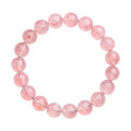 Natural white water strawberry quartz geometric ball bracelet with 10-10.8mm beads on a wrist.