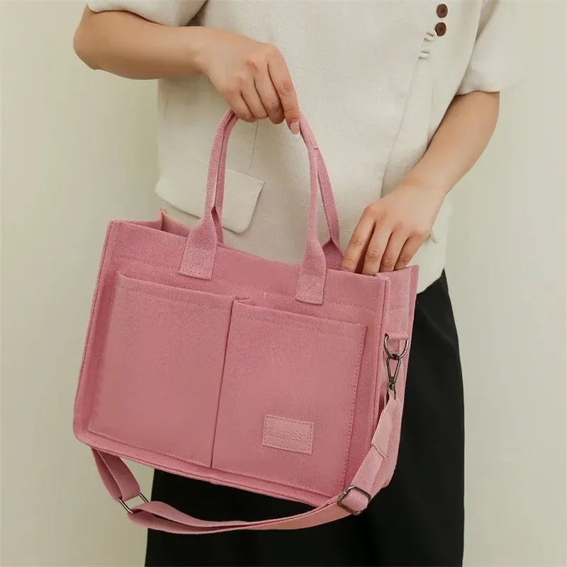 Large casual canvas tote shoulder bag for women with multiple pockets in creamy white
