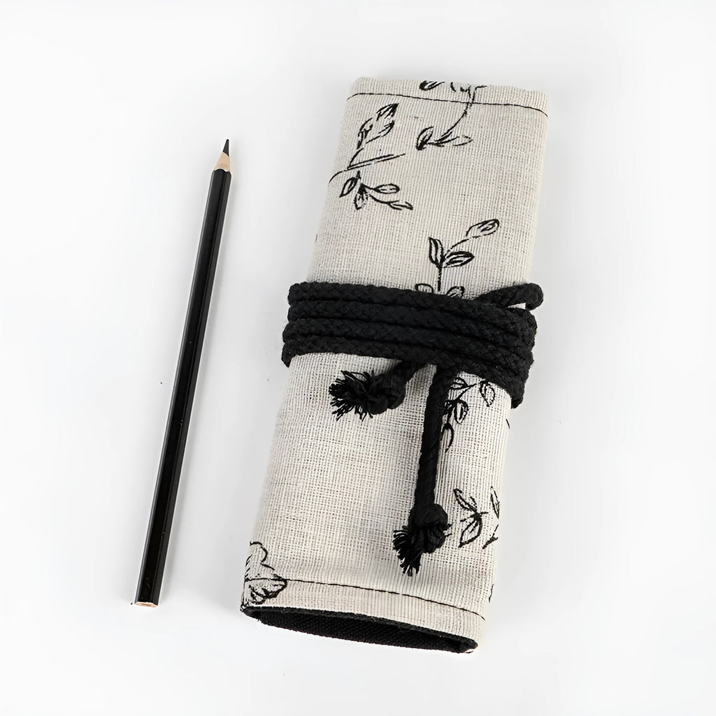 Black Peony printed canvas pencil roll bag open to show 72 holes for pens and pencils