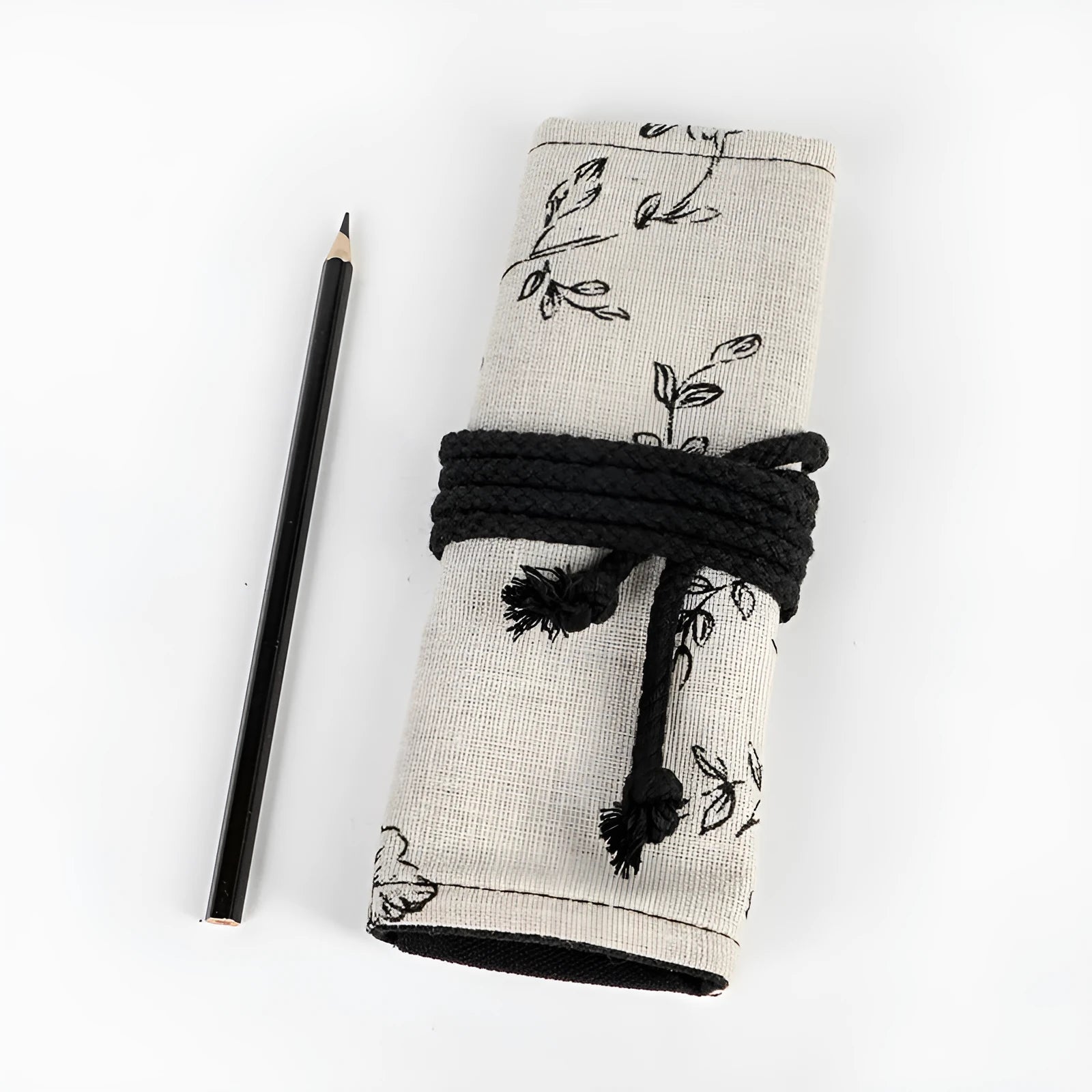 Black Peony printed canvas pencil roll bag open to show 72 holes for pens and pencils