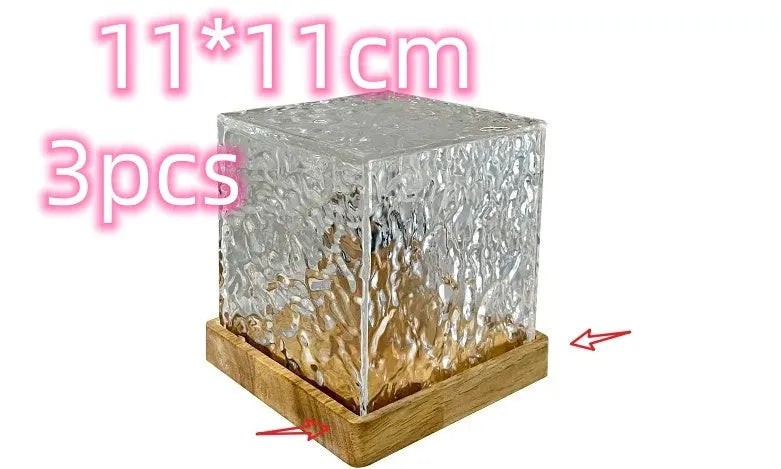 LED water ripple projection night light with remote control on wooden table