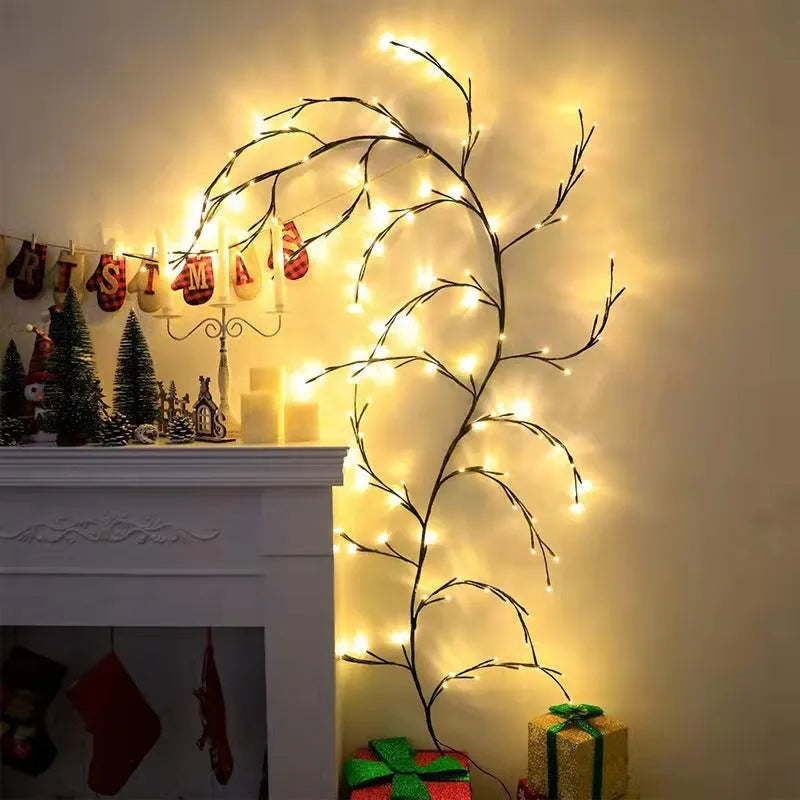 Flexible willow vine LED garland with warm white lights and white birch bark texture, bent into a decorative shape.